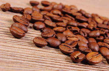 Heap of coffee on wooden background