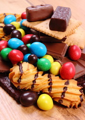 Sweets on wooden surface, unhealthy food