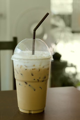 Ice coffee on wooden table