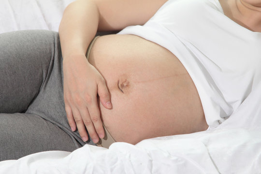 Belly of pregnant women near birth,Asian people