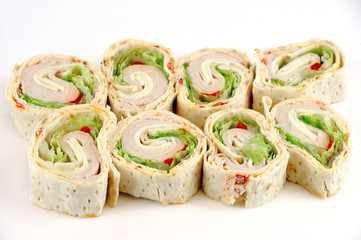 tortilla deli wrap rolls with ham vegetable isolated on white background