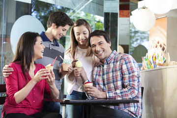 Happy Man Having Ice Cream With Family
