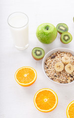 Bowl of rolled oats with fruit and milk