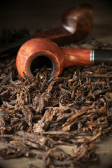Pipe on tobacco pile