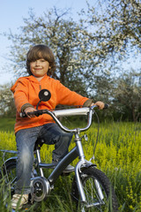 Fototapeta premium boy ride bikes