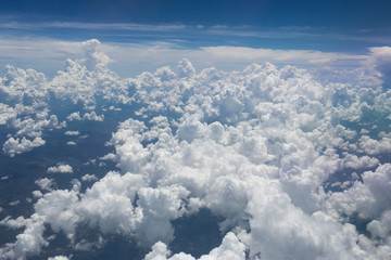 Above the clouds.Aerial cloudscape sky in stratosphere shot from airplane window