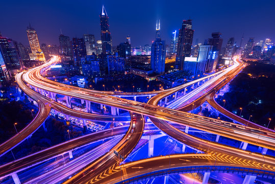 Aerial view of a highway overpass at night in Shanghai -  China.