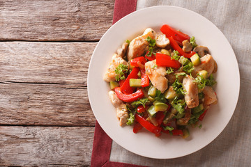 Chicken saute with mushrooms and vegetables close-up. horizontal top view
