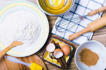 Wooden background with baking ingredients. Top view.