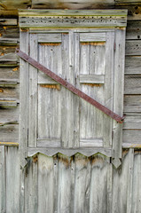 closed window of an old wooden house