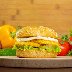 burgers on wooden background