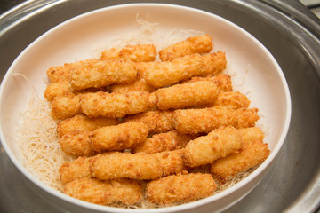 Fish fingers on the white plate