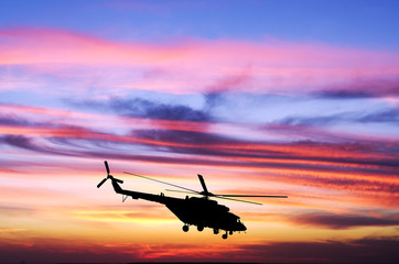 Fototapeta na wymiar Helicopter at sunset