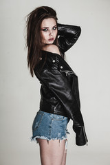 young pretty sexy woman in leather jacket