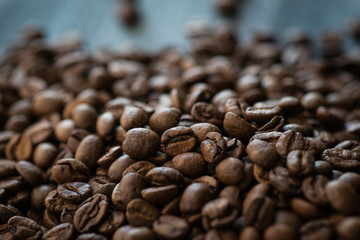 Roasted coffee beans on old wooden table