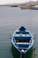 Naklejka premium Rowing boat in the marina at Cannigione