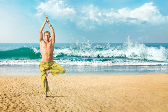 Man meditating in tree position