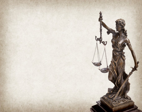 Statue of justice on old paper background, law concept