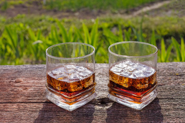Two glasses of cola with ice