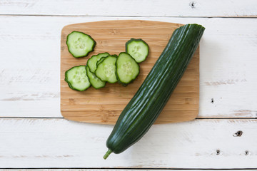Cucumber on a white wooden table
