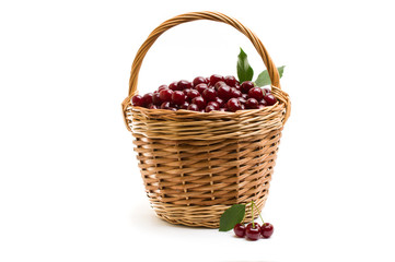 Basket full of fresh red cherry on a white background