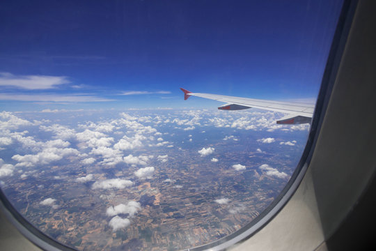 Looking through window aircraft during flight in wing with top view
