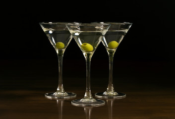 Three glasses with a martini cocktail