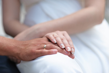 Fototapeta na wymiar Male and female hand with rings