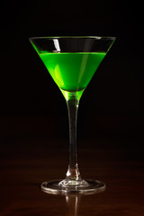 Glass of green cocktail