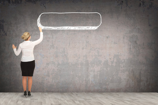 Business woman drawing on the wall. business concept
