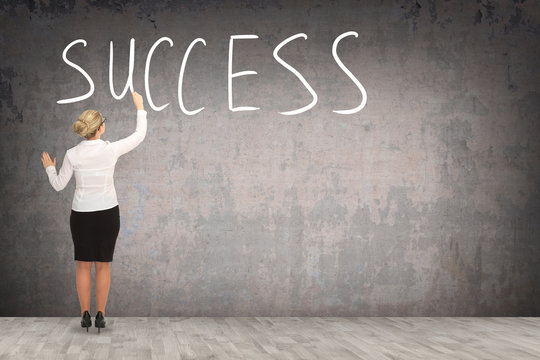 Business woman drawing on the wall. business concept
