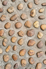 background made of a closeup of a wall with pebbles