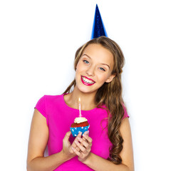 happy woman or teen girl with birthday cupcake