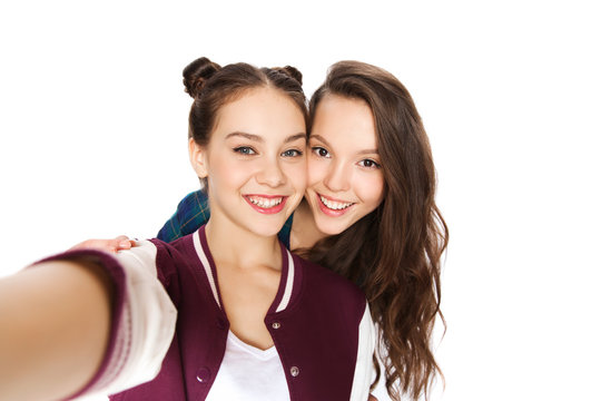 happy smiling pretty teenage girls taking selfie