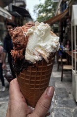 a female hand holding ice cream