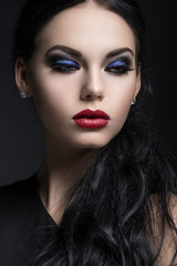 Fototapeta na wymiar Closeup portrait of beautiful young girl with expressive makeup