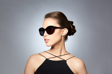 beautiful young woman in elegant black sunglasses