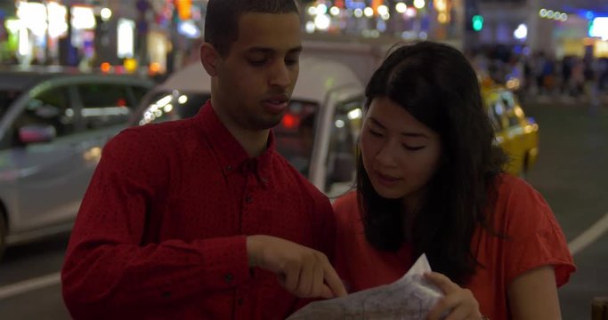 Young Couple lost in Tokyo Shibuya Sight seeing tourists Japan 4k 