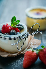 Fresh and healthy natural yogurt with berries on wooden table