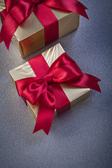 Packed giftboxes on grey background holidays concept