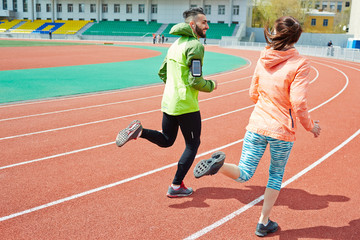 Fototapeta premium Young couple running