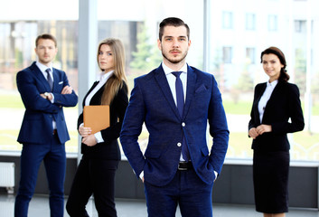 Fototapeta premium Group portrait of a professional business team looking confidently 