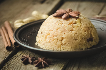 semolina halva, halvah, halava sweet desert with raisiins and nuts