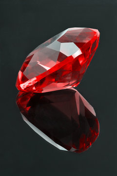 red ruby with reflection on dark background
