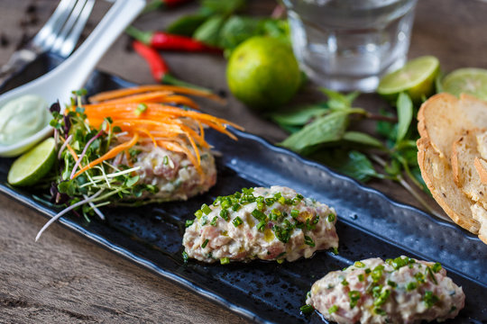 Fish tartare with herbs and carrot