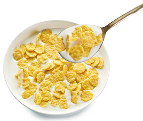 Cornflakes in the bowl on white background.