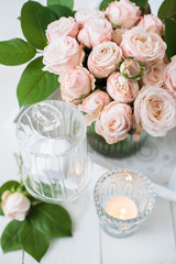 vintage wedding table decorations with roses, candles, cutlery a
