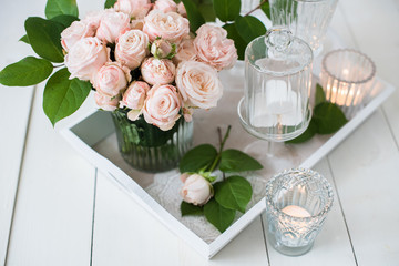 vintage wedding table decorations with roses, candles, cutlery a