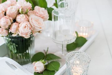 vintage wedding table decorations with roses, candles, cutlery a