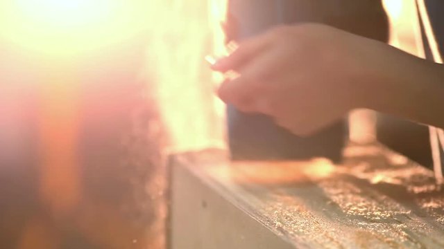 Carpenter polishing wood using electric grinder with polishing extender. close up